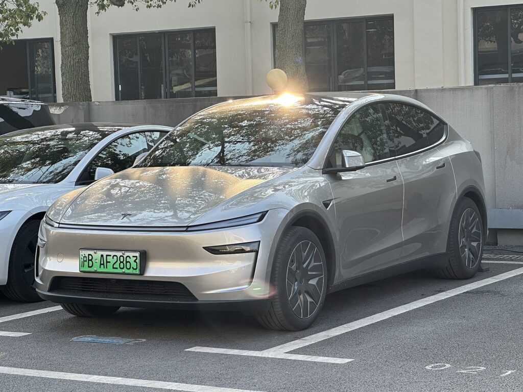 Tesla Model Y L silver front three-quarter view