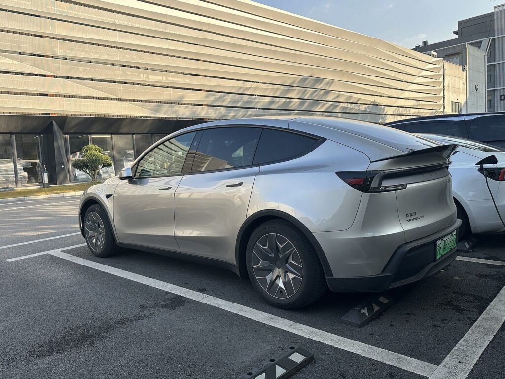 Tesla Model Y L silver rear three-quarter view