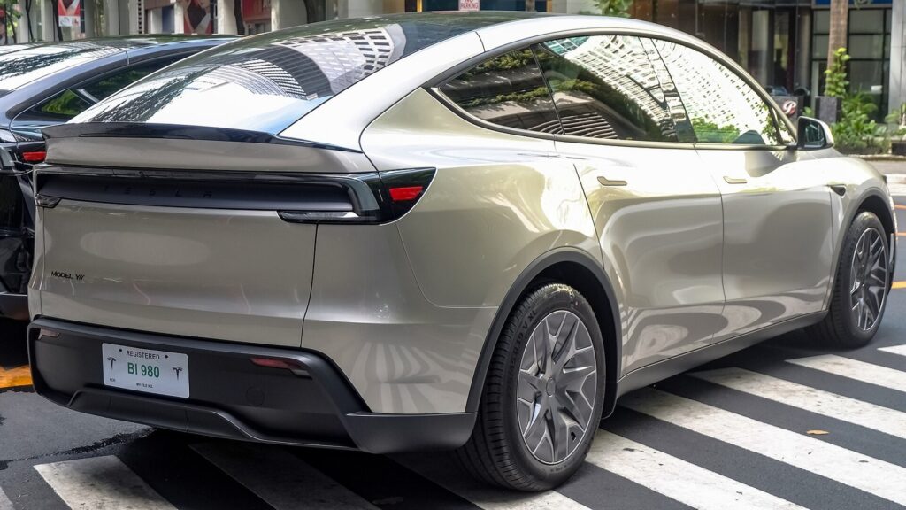 Tesla Model Y L Cosmic Silver rear three-quarter view