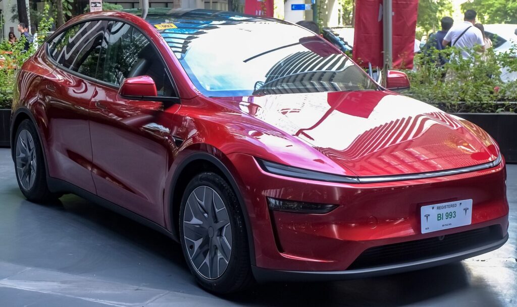 Tesla Model Y L Ultra Red front three-quarter view