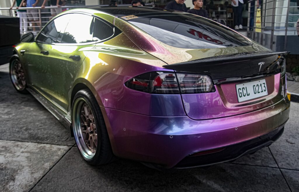Tesla Model S Plaid front three-quarter view for Porsche Taycan comparison
