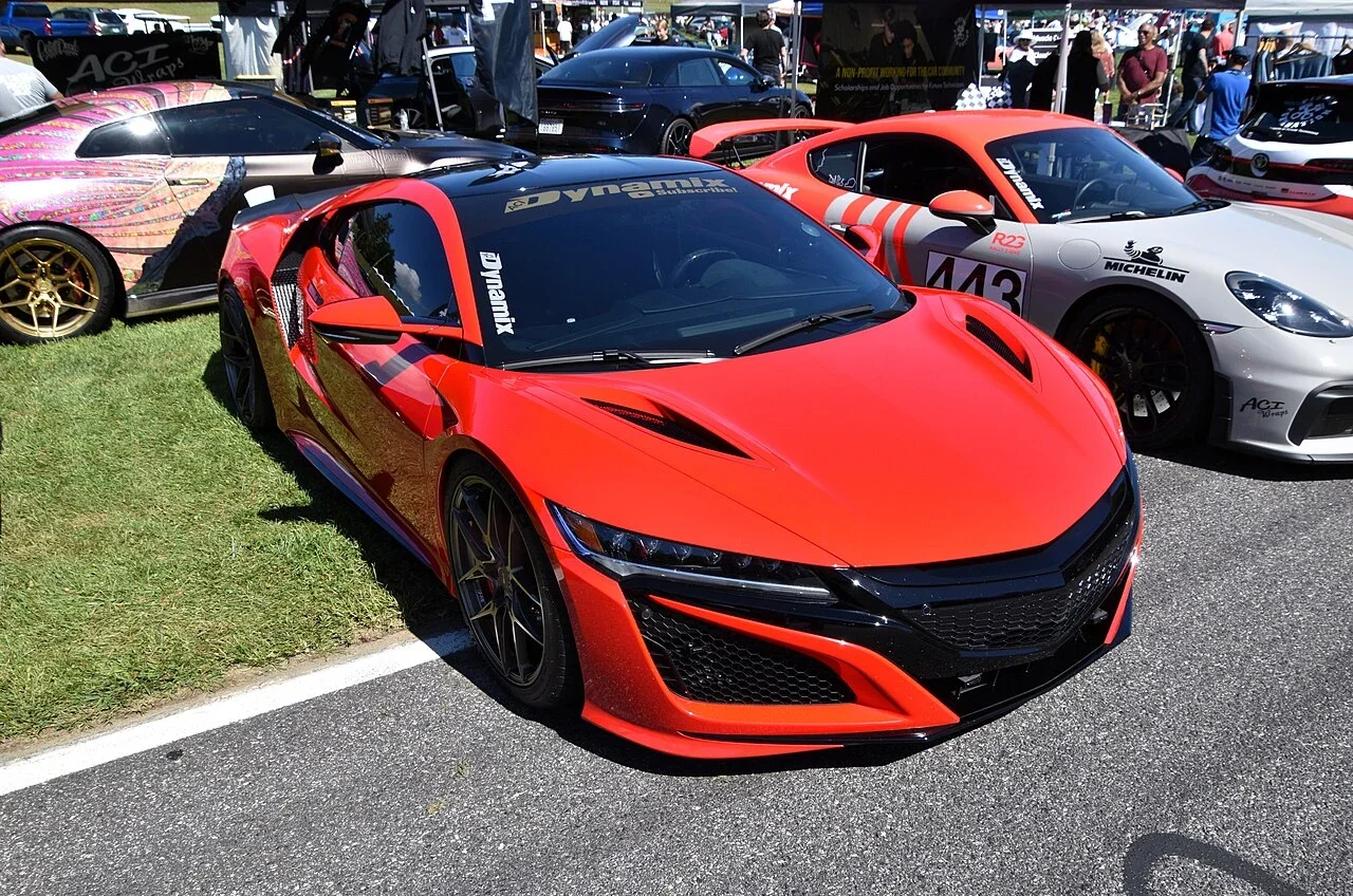 Orange Acura NSX standard coupe at a gathering