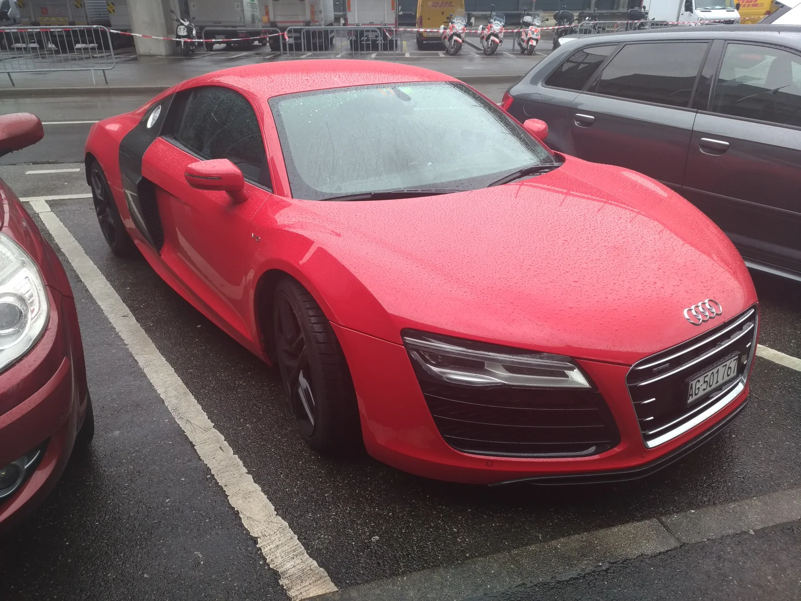 red Audi R8 V10 viewed from the front at a car show