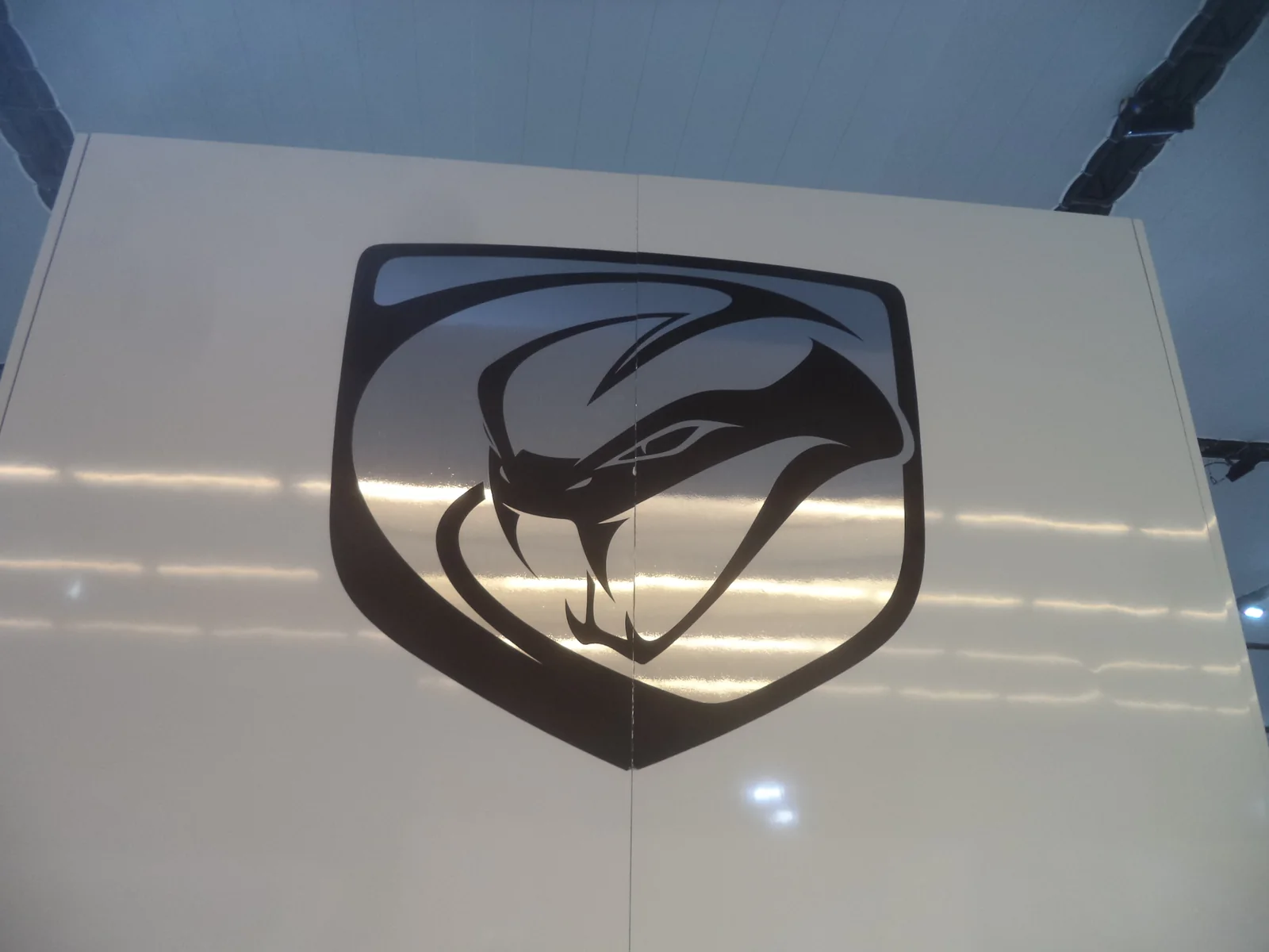 Dodge Viper snake logo badge on a vehicle surface