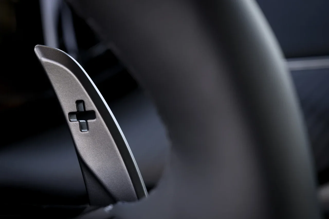 Aston Martin Vantage metal upshift paddle behind the steering wheel