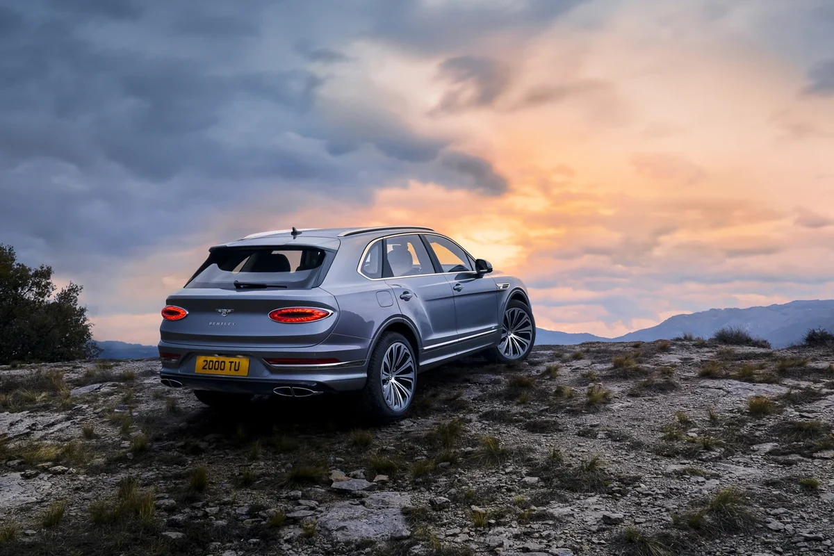 Facelift Bentley Bentayga V8 rear three-quarter at sunset