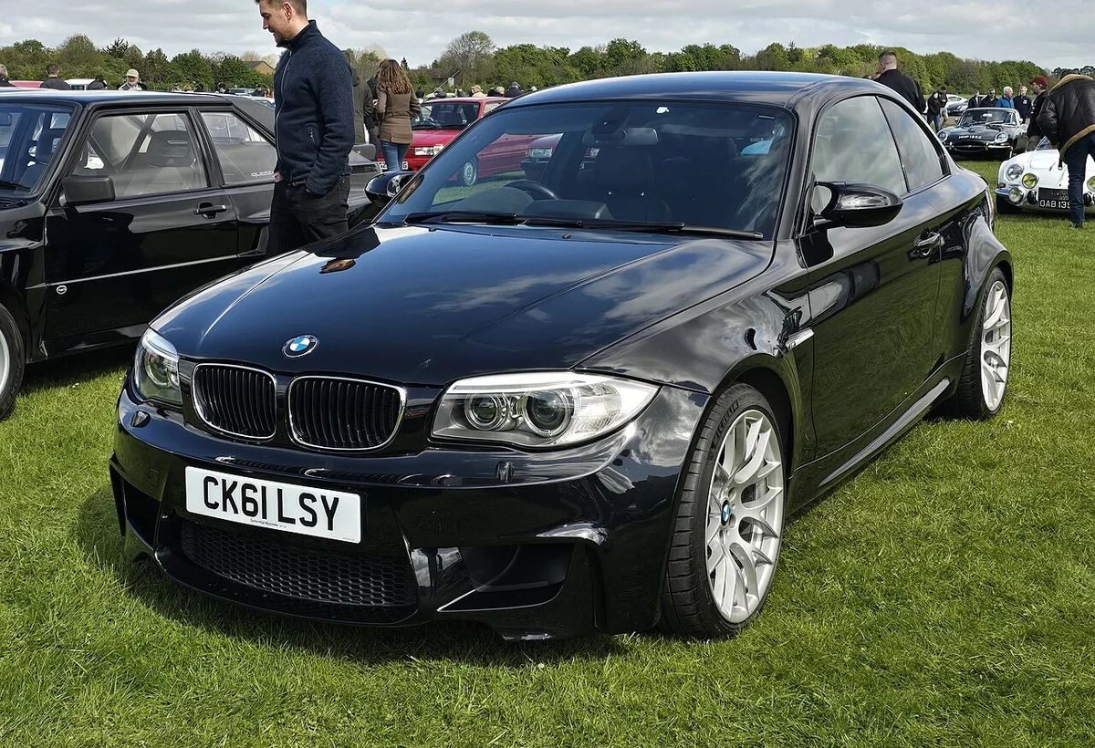 Black 2011 BMW 1M front three-quarter view