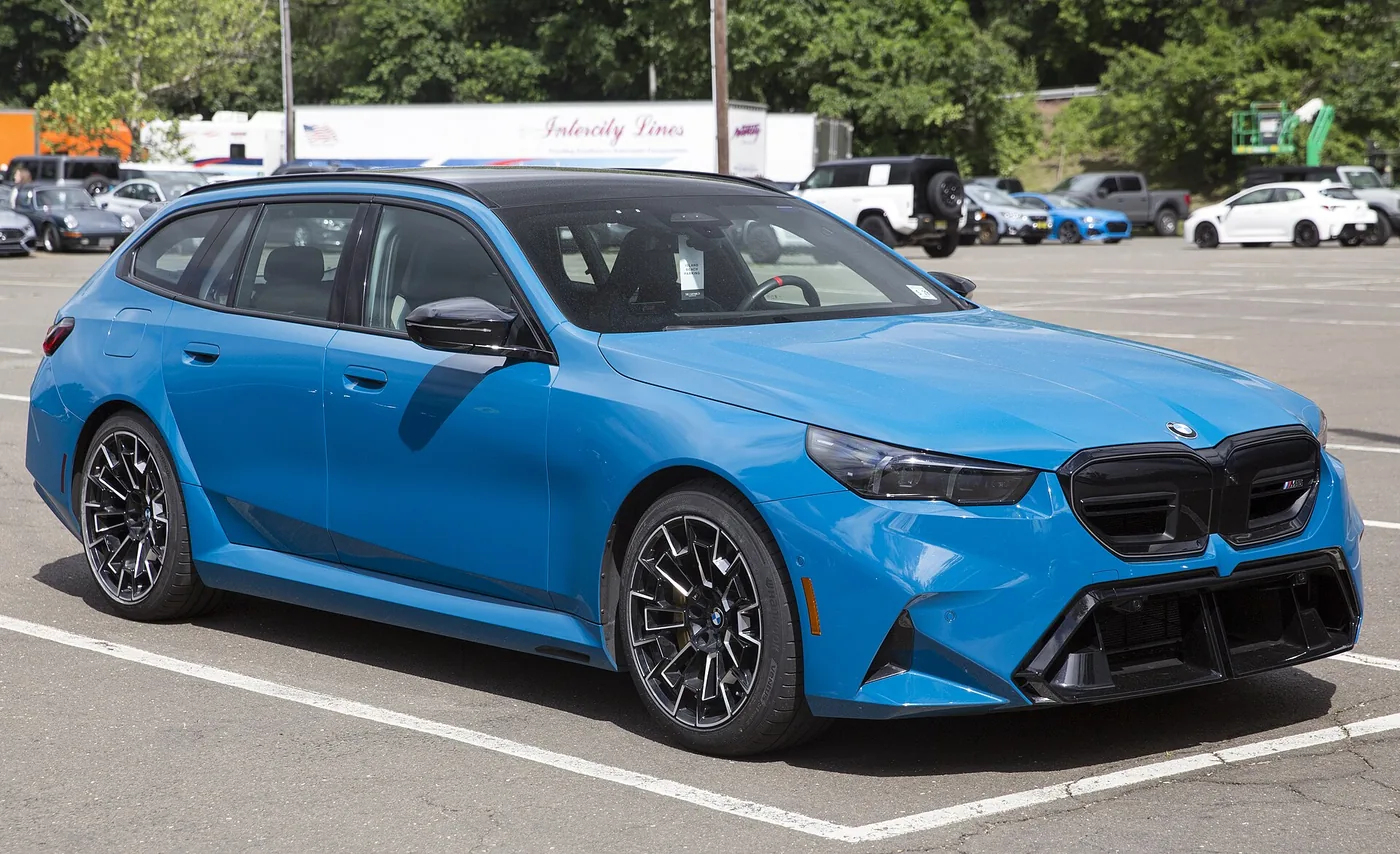 2025 BMW M5 Touring in M Marina Bay Blue Metallic, front right