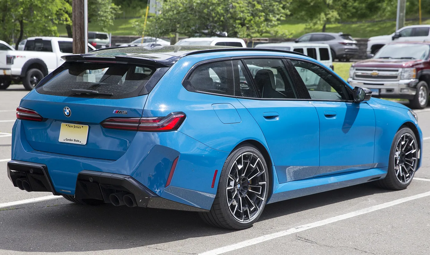 2025 BMW M5 Touring in M Marina Bay Blue Metallic, rear right