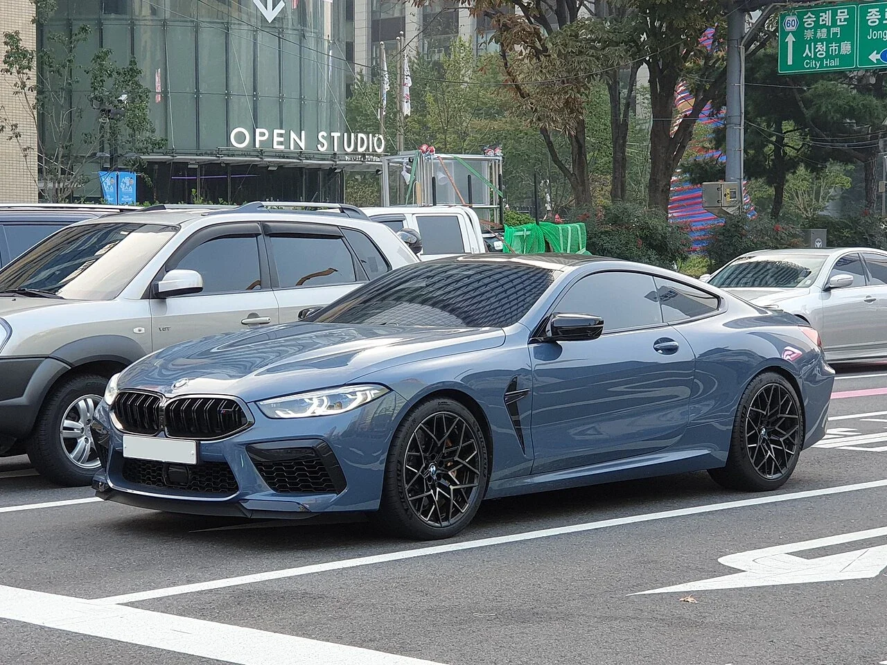 Blue BMW F92 M8 Competition on a city street