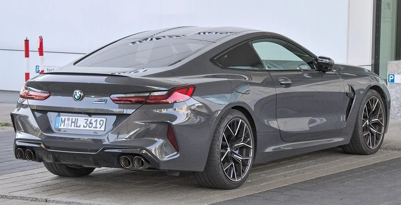 Gray BMW M8 Competition two-door rear quarter