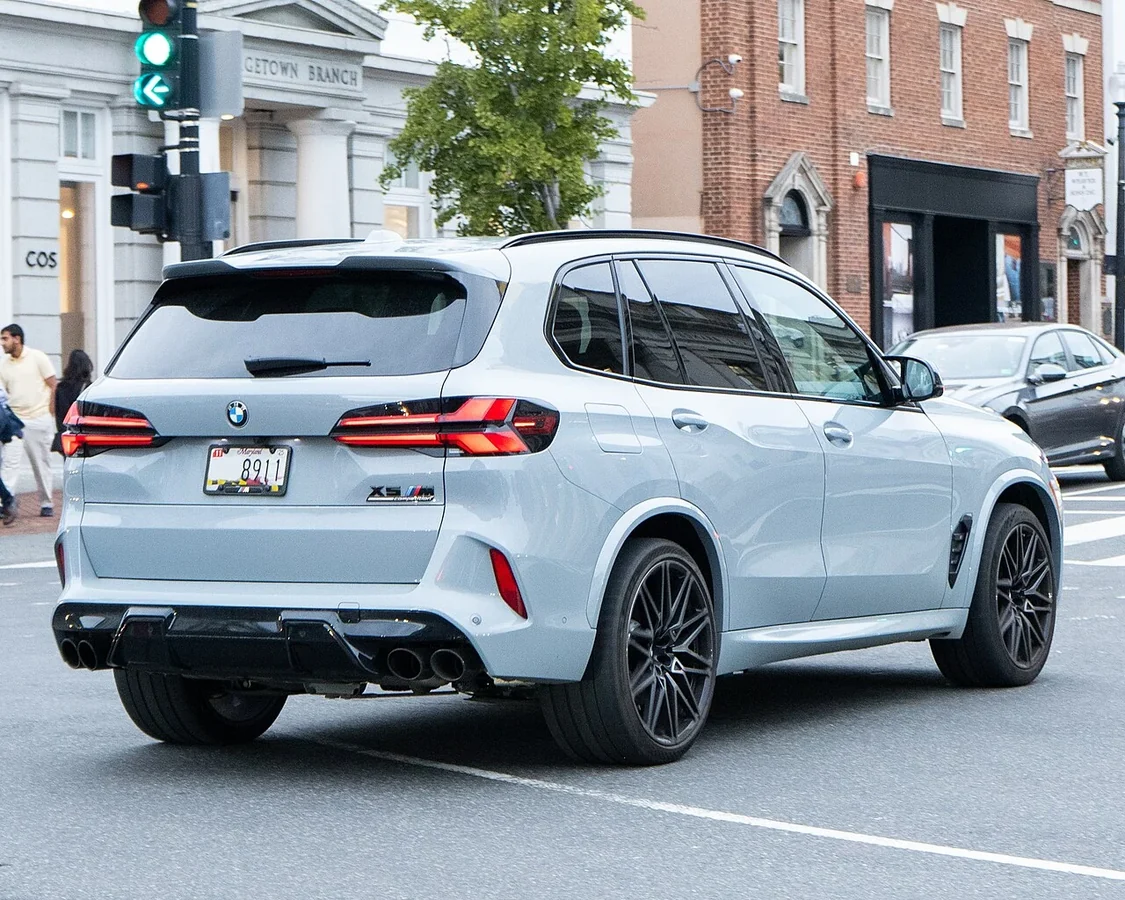 White BMW X5 M F95 rear three-quarter