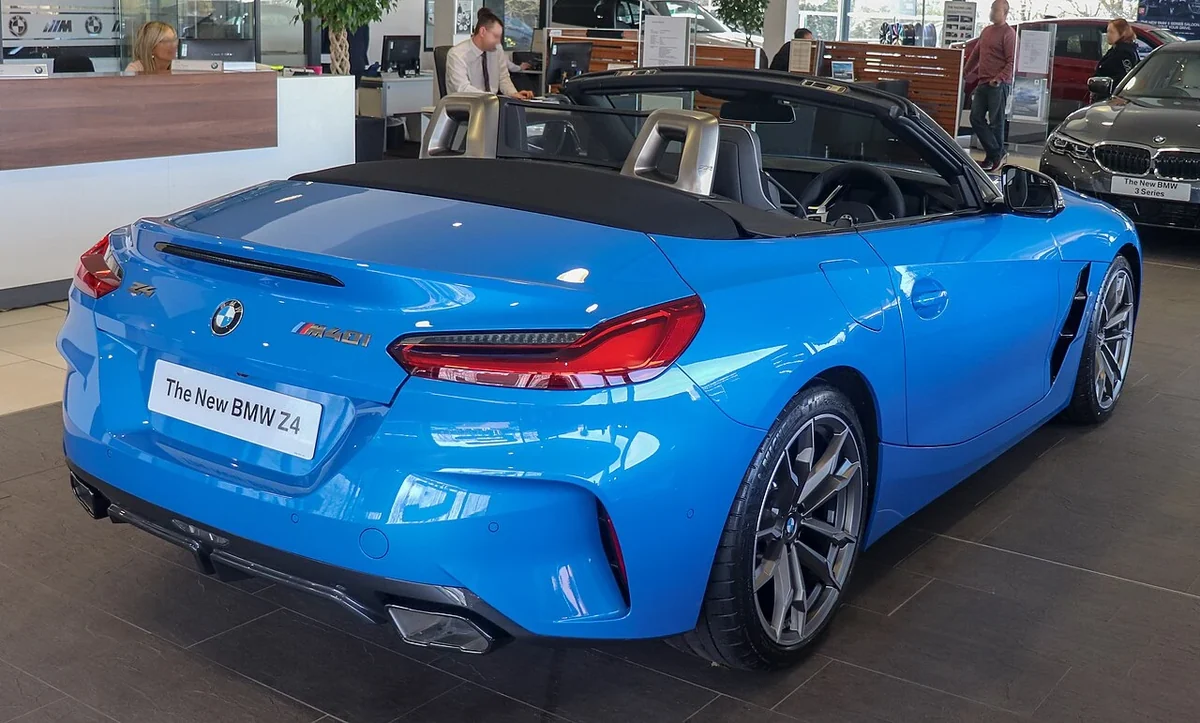 Blue BMW Z4 M40i rear three-quarter with roof lowered