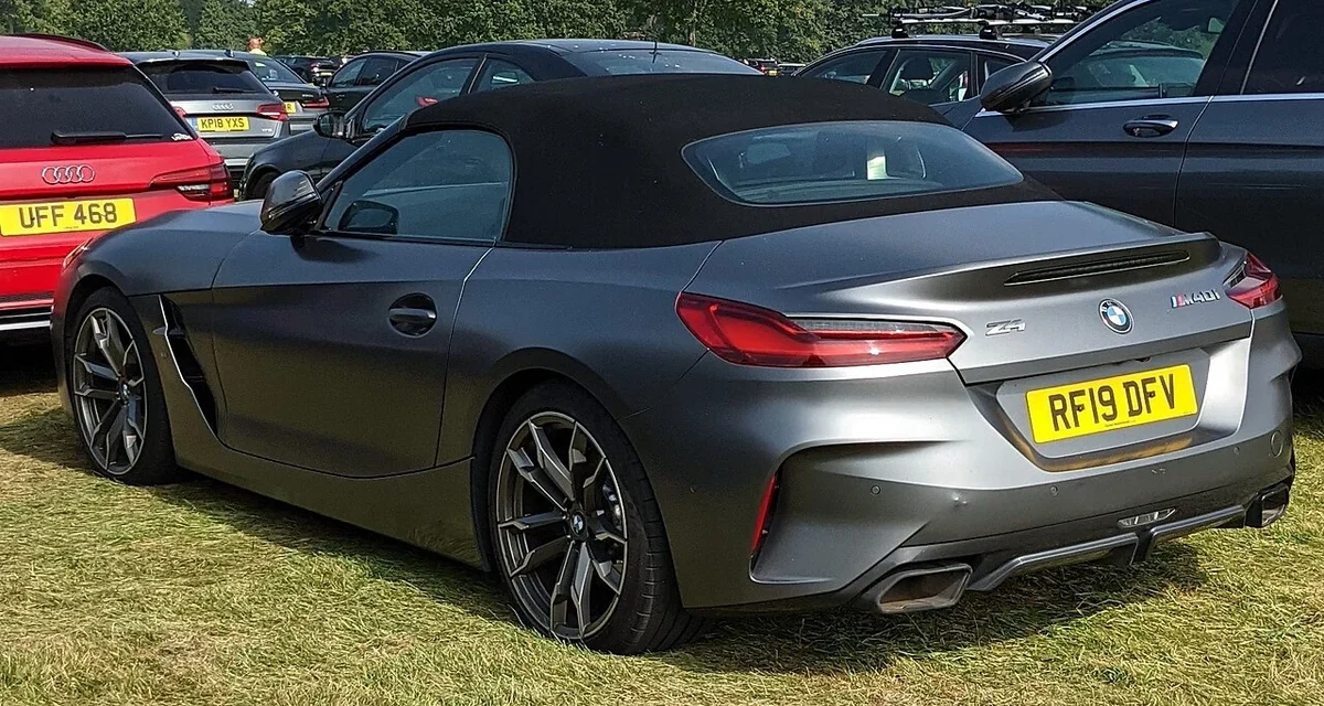 Gray early BMW Z4 M40i rear three-quarter with soft top raised