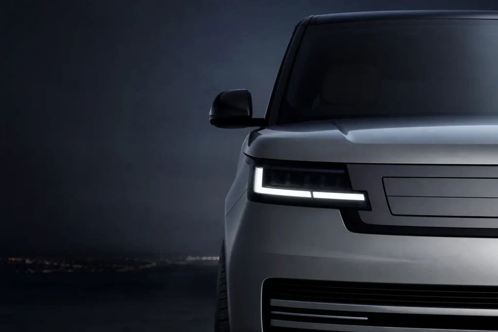 A 2027 Land Rover Range Rover Electric luxury SUV viewed from the front three-quarter angle.