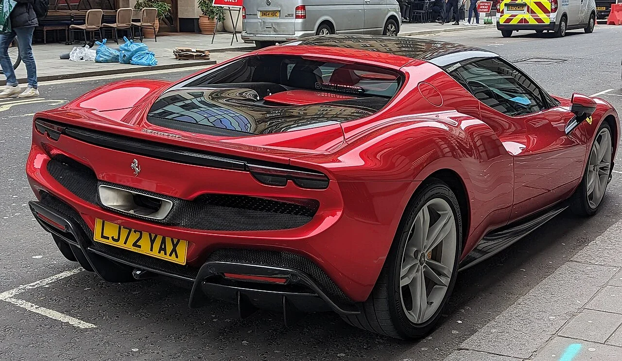 Red Ferrari 296 GTB rear three-quarter view