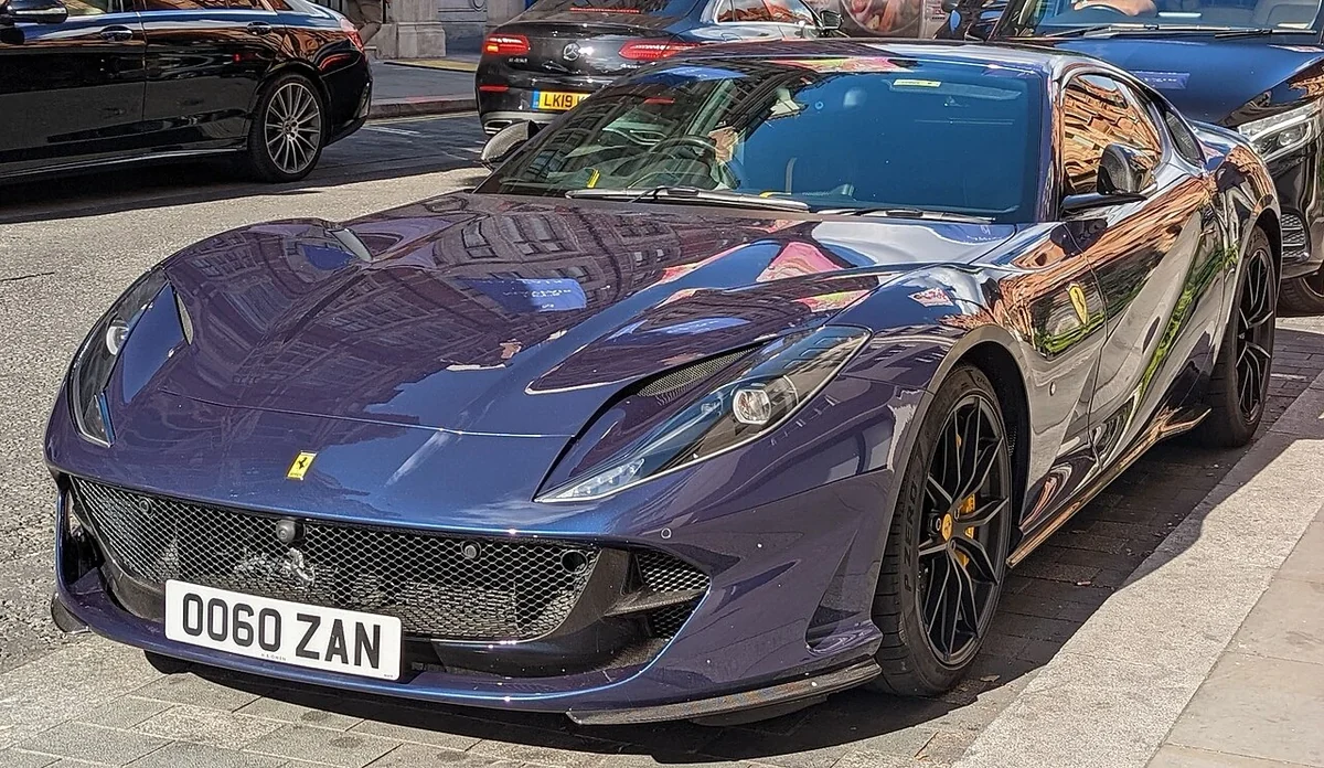 Blue Ferrari 812 Superfast coupe front three-quarter on a street