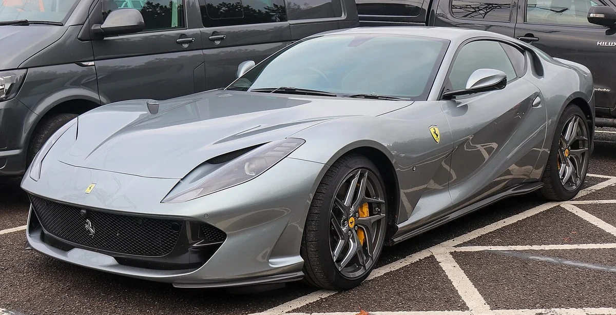 Silver Ferrari 812 Superfast parked outside
