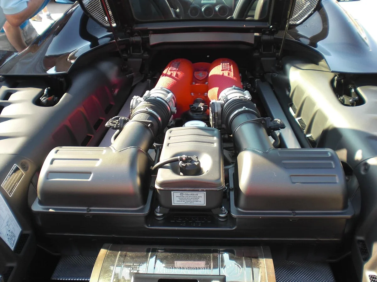 Ferrari F430 V8 engine bay with red intake covers