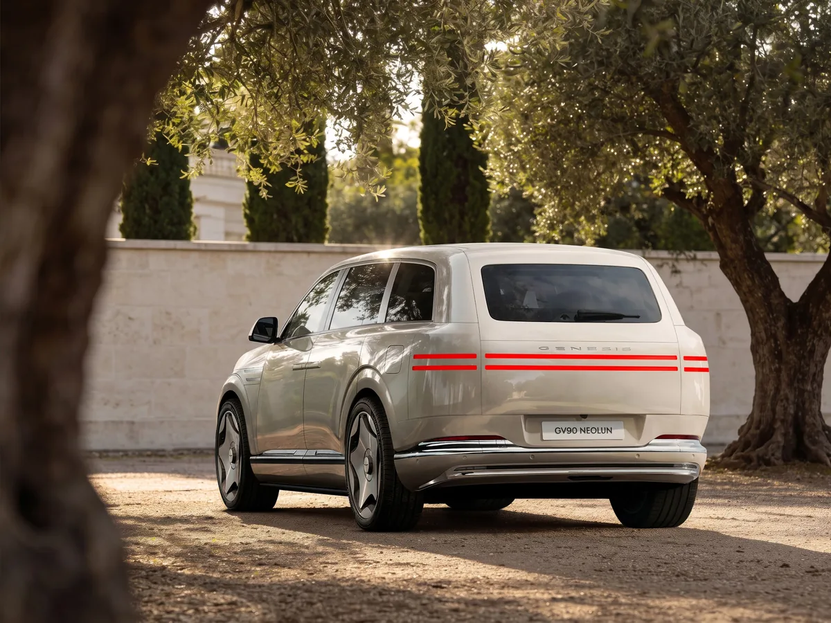 White Genesis GV90 standard model viewed from the rear three-quarter angle