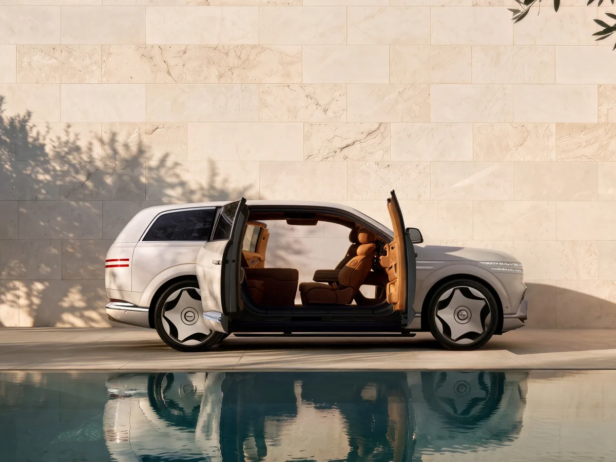 White Genesis GV90 Neolun with front and rear coach doors open