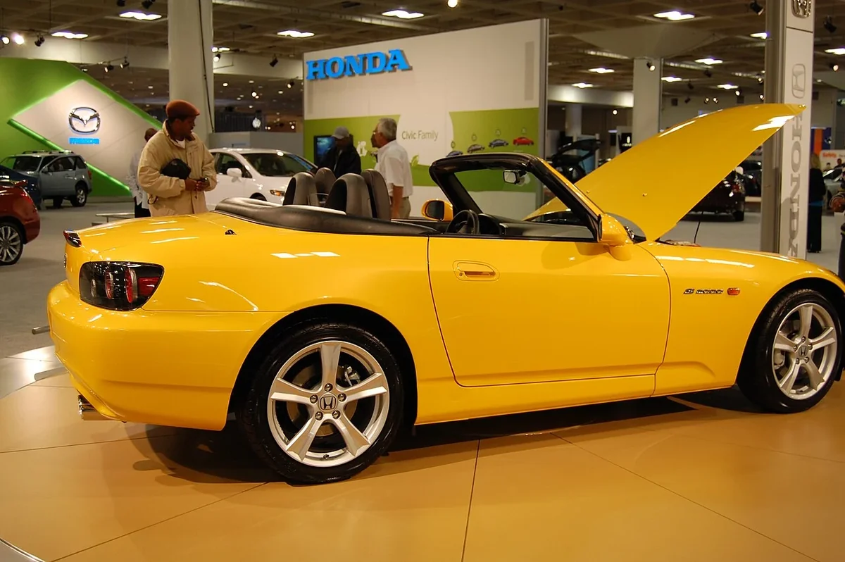 2009 S2000 side profile, with its compact two-seat roadster layout.