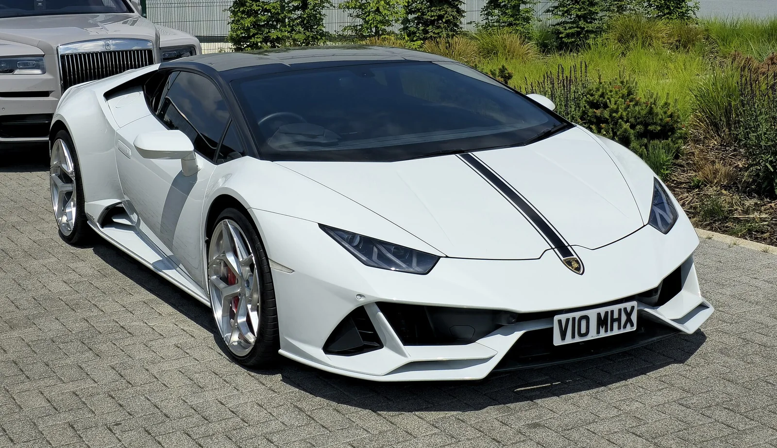 White Lamborghini Huracán EVO Spyder front three-quarter view