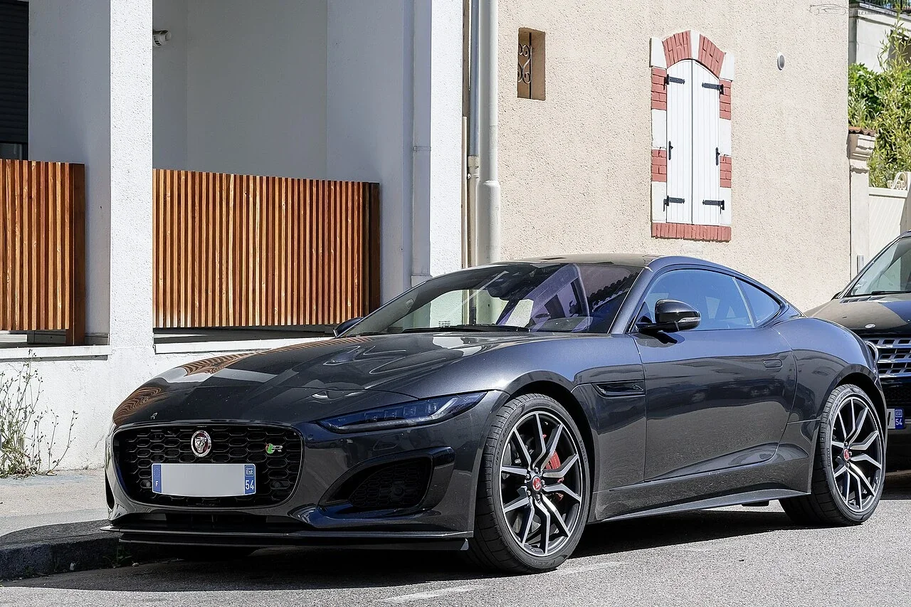 Dark blue facelift Jaguar F-TYPE R Coupe parked outdoors