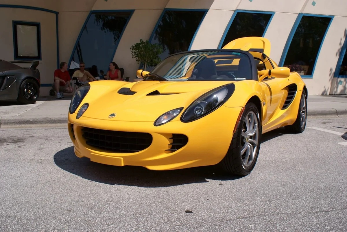 Yellow 2005 Lotus Elise front three-quarter view