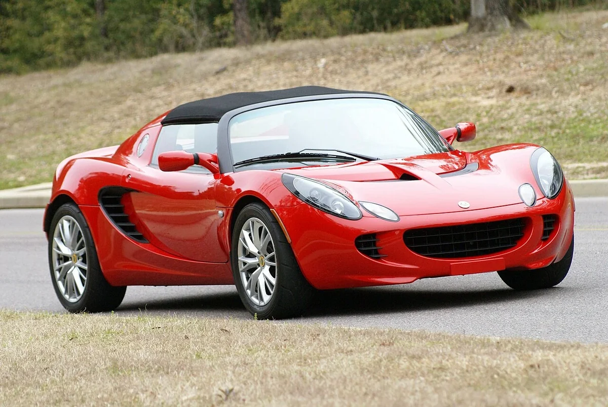 Red 2005 Lotus Elise on a road