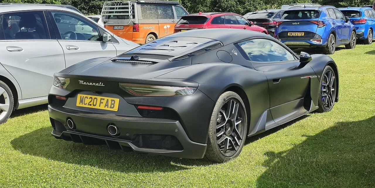 Dark Maserati MC20 coupe rear at a gathering