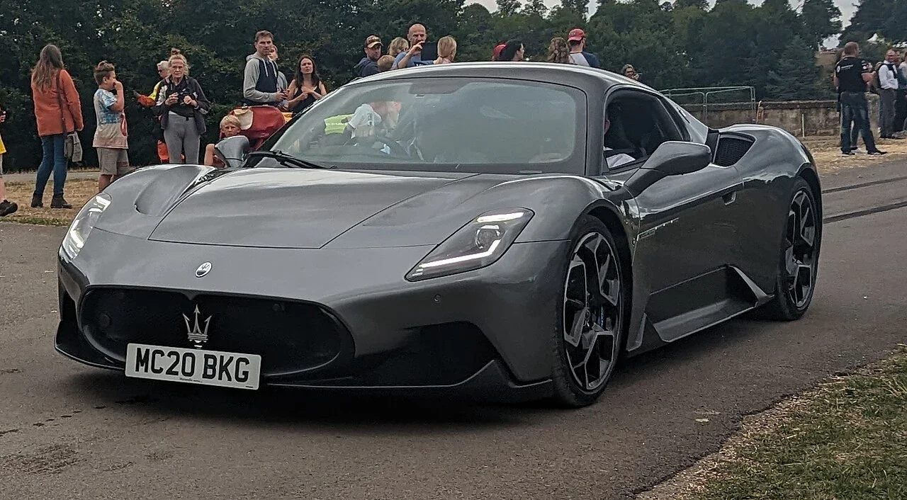 Gray Maserati MC20 coupe at an outdoor gathering