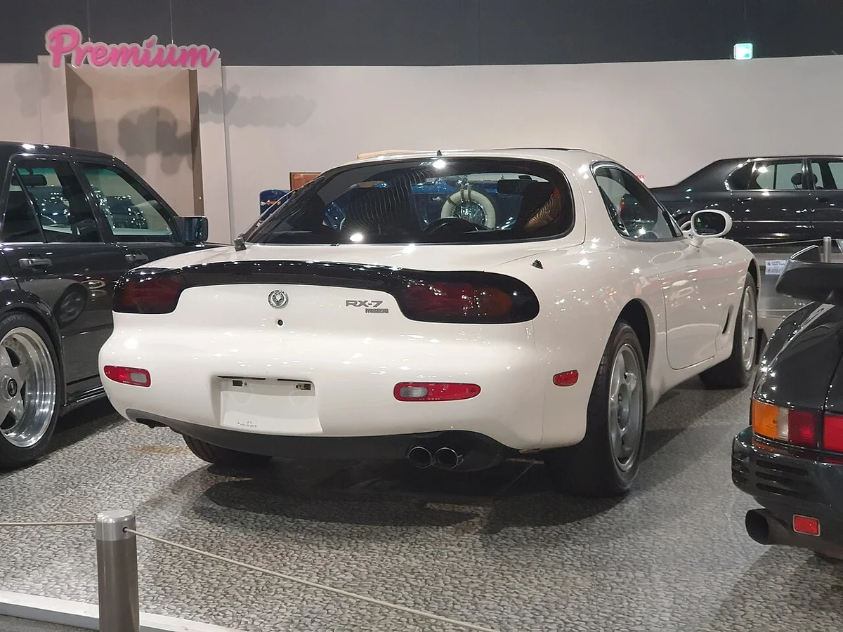 White Mazda RX-7 FD rear three-quarter view