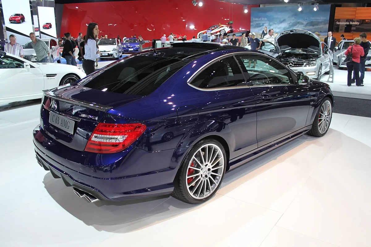 Blue Mercedes C63 AMG C204 coupe rear three-quarter view