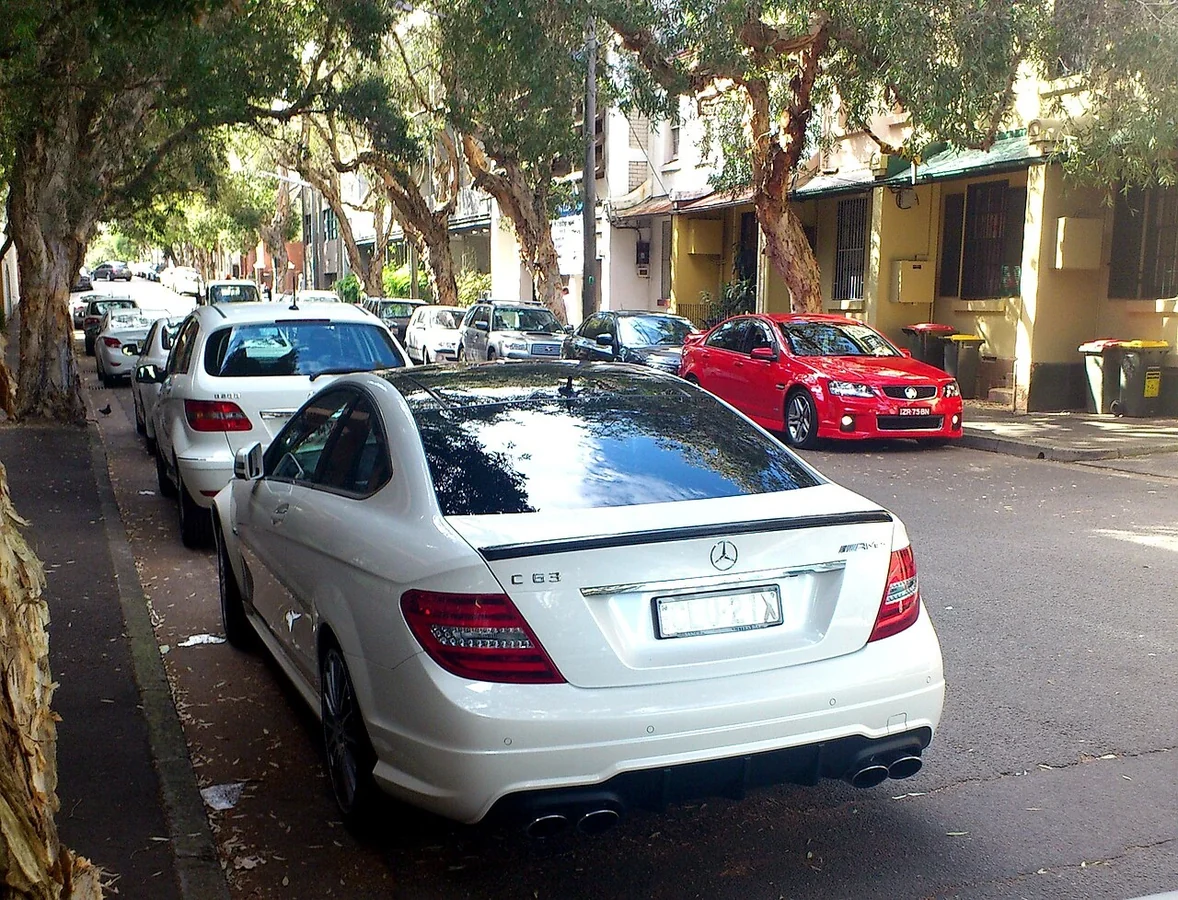 Silver Mercedes C63 AMG C204 coupe viewed from the rear