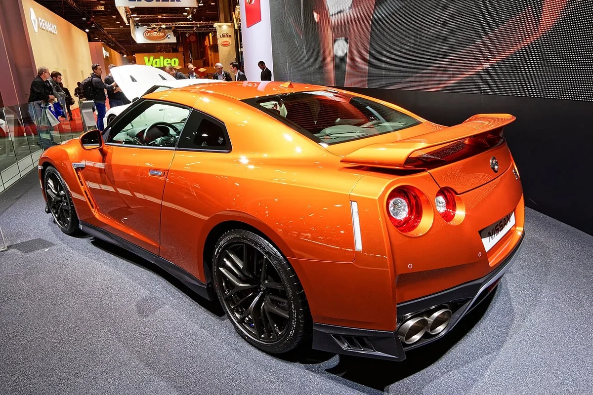 Orange facelift Nissan GT-R rear three-quarter view at Paris show