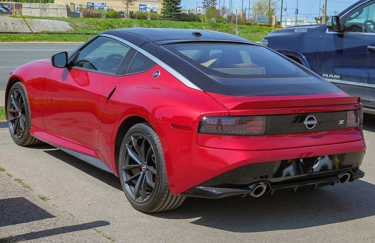 Red Nissan Z Performance manual rear three-quarter view