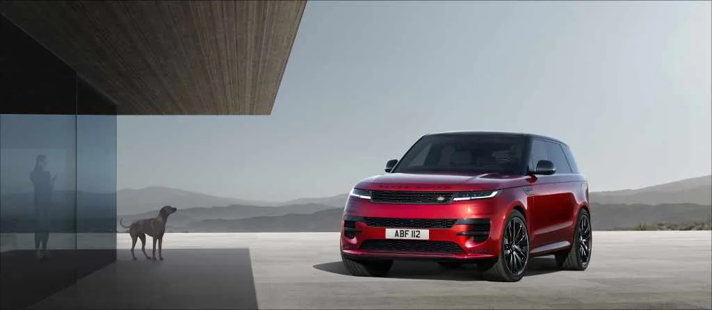 Red Range Rover Sport driving away from paved roads