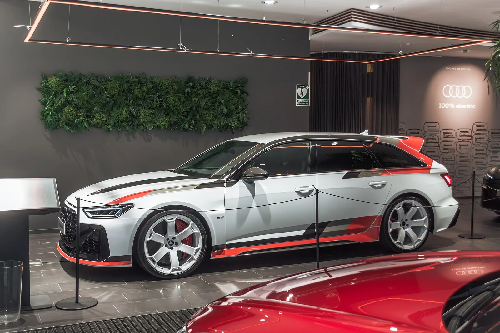 White Audi RS 6 Avant GT with red and gray graphics