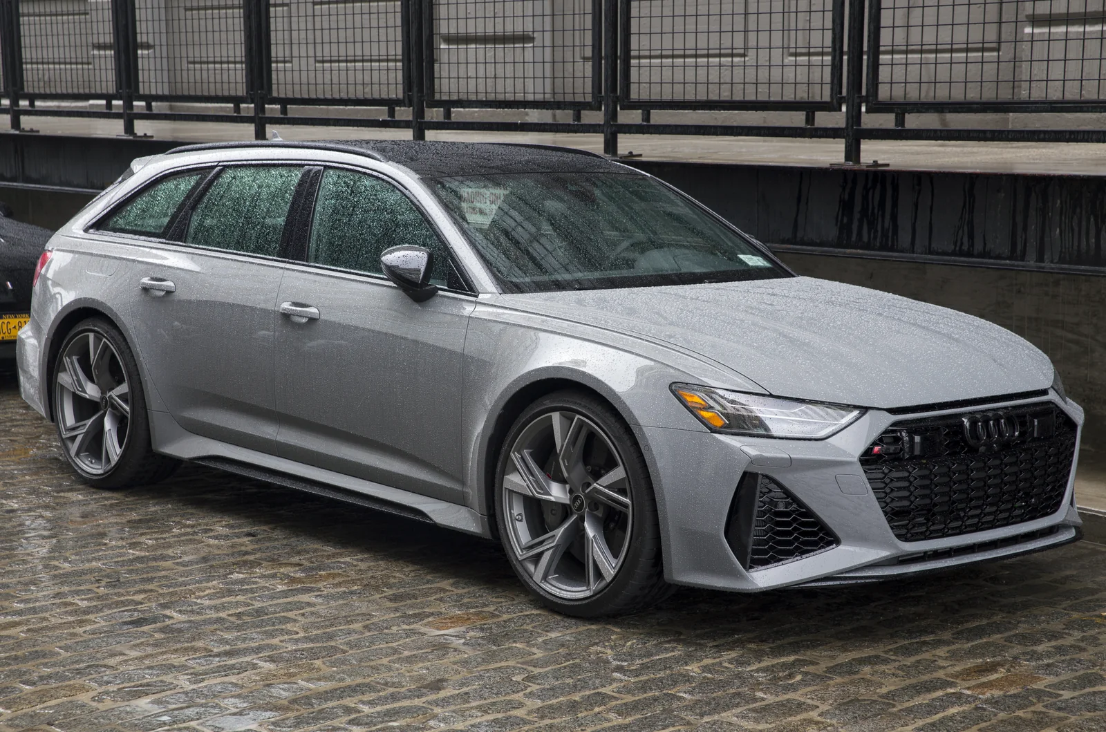 Nardo gray Audi RS 6 Avant front three-quarter view in the rain