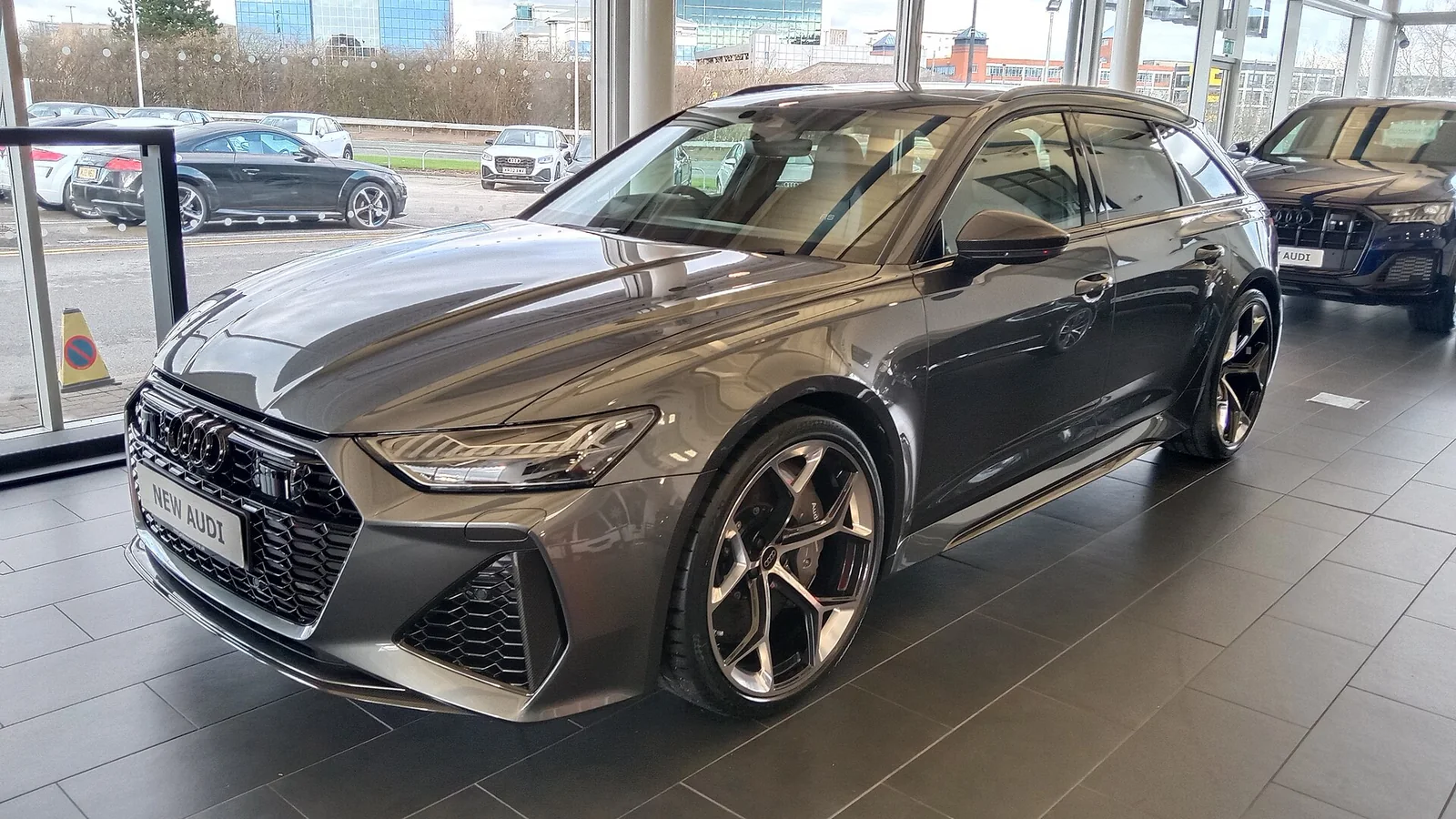 Nardo gray Audi RS 6 Avant displayed indoors