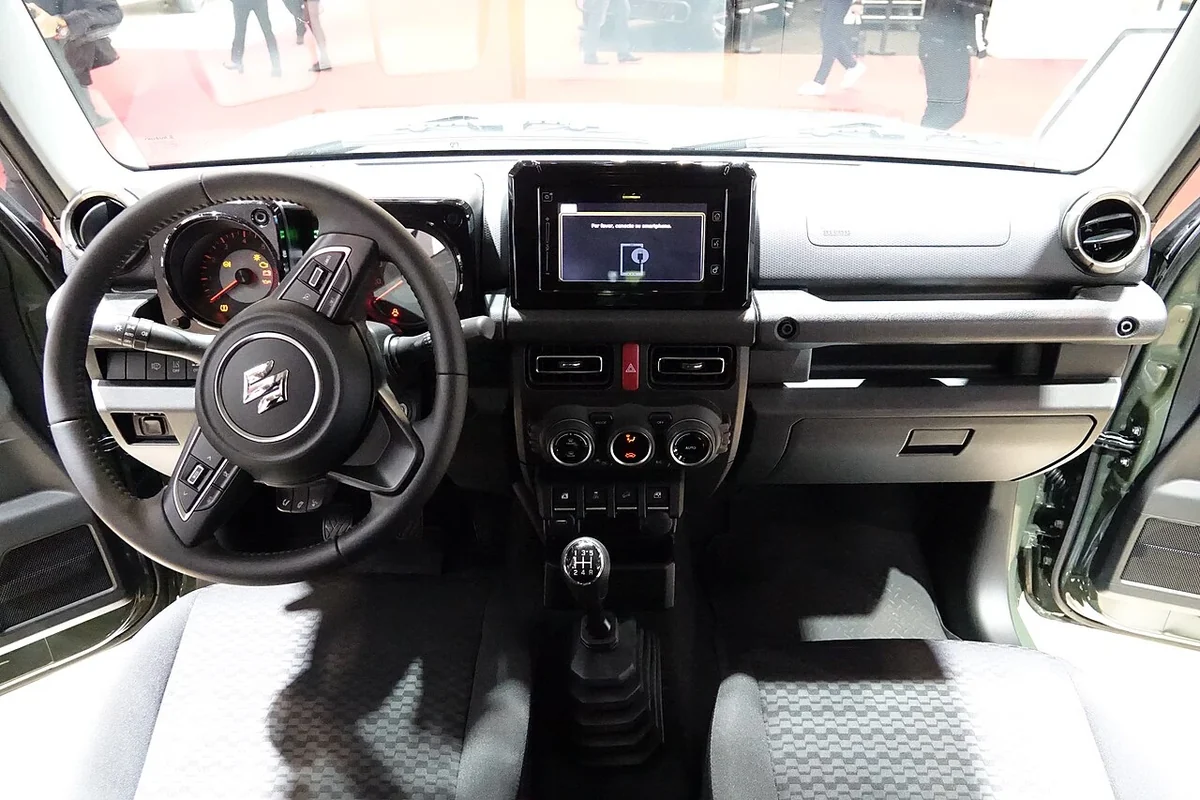 Left-hand-drive 2018 Jimny interior as a layout reference; do not assume identical local equipment.
