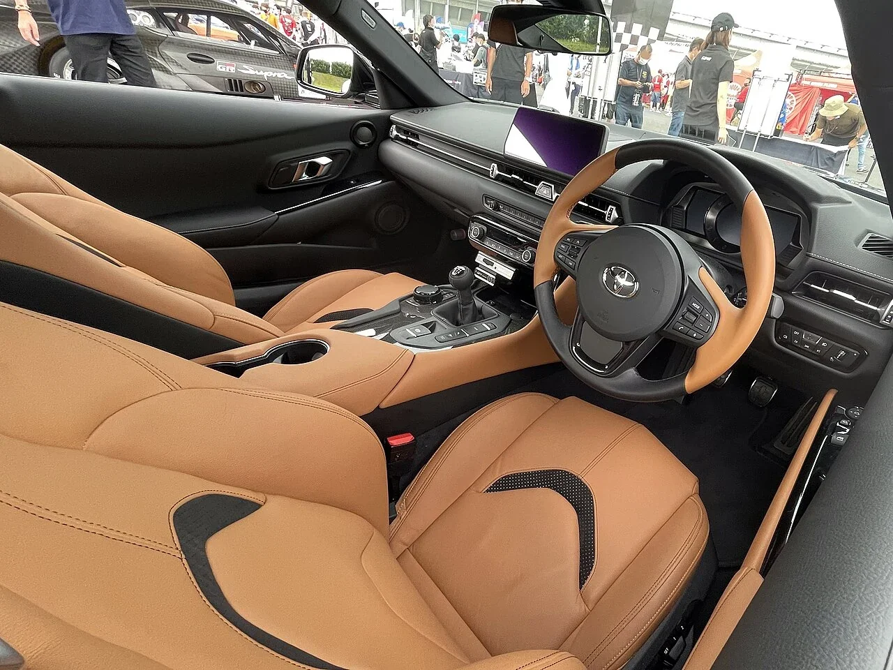 Right-hand-drive Toyota GR Supra RZ 6MT cabin with tan seats