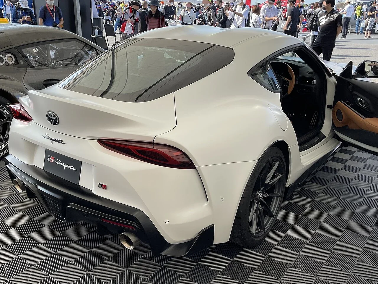 White Toyota GR Supra RZ 6MT rear three-quarter view