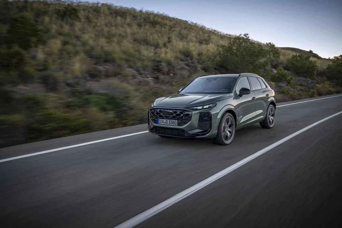 Audi Q3 SUV driving on a road