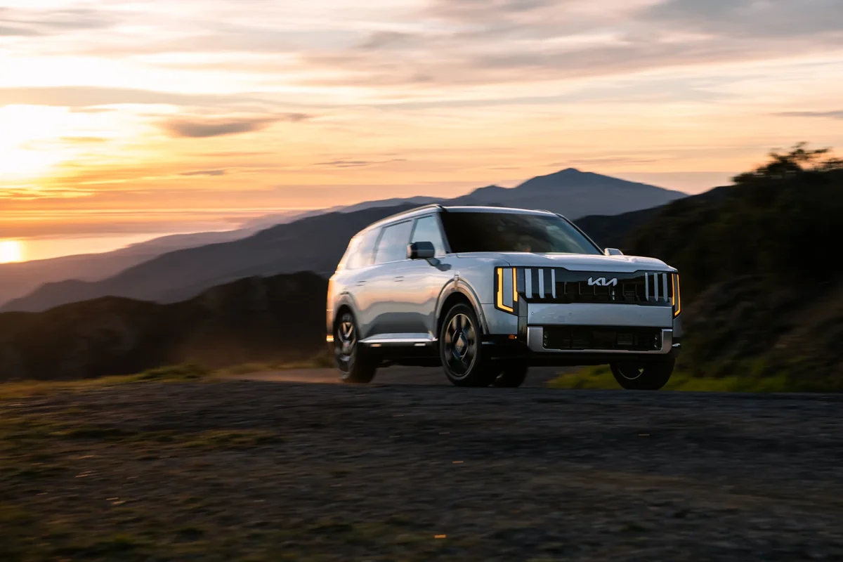 Kia Telluride Hybrid front three-quarter view on a mountain road