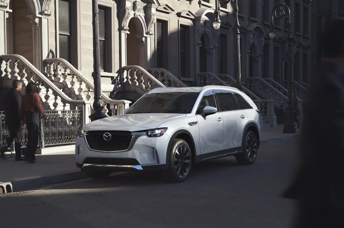 Mazda CX-90 front view in a city setting