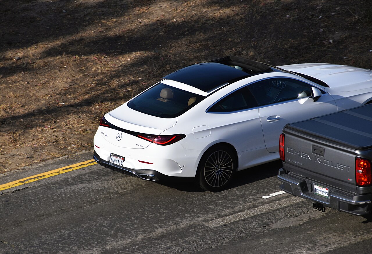 White C236 CLE 300 4MATIC coupe viewed from above and behind