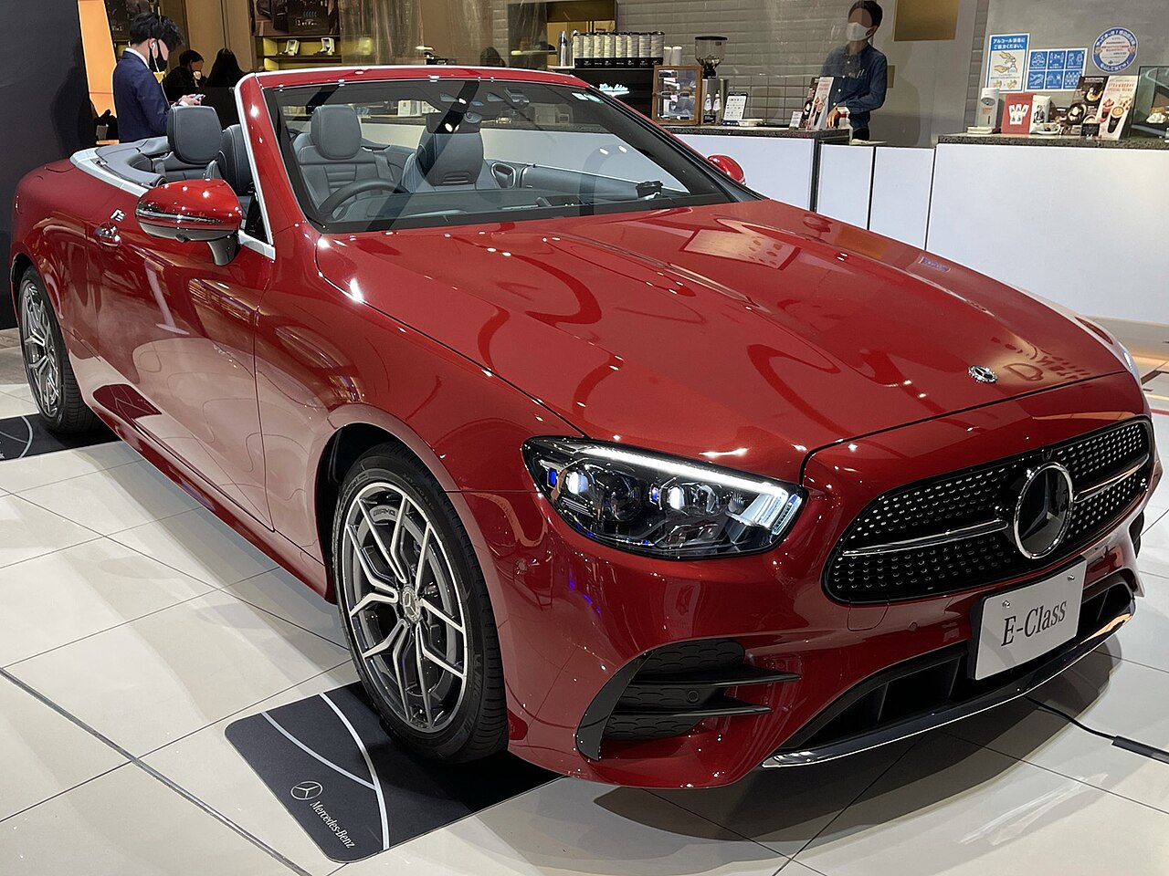 Red facelift A238 E 200 Cabriolet with roof lowered