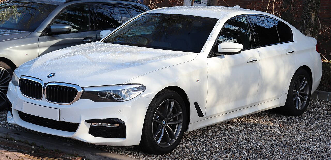 White early G30 BMW 520d M Sport front three-quarter view